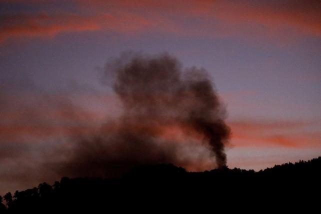 Smoke rises near Fort Tiuna, after US President Donald Trump said the US has struck Venezuela and captured its President Nicolas Maduro, in Caracas, Venezuela, January 3, 2026. REUTERS/Leonardo Fernandez Viloria