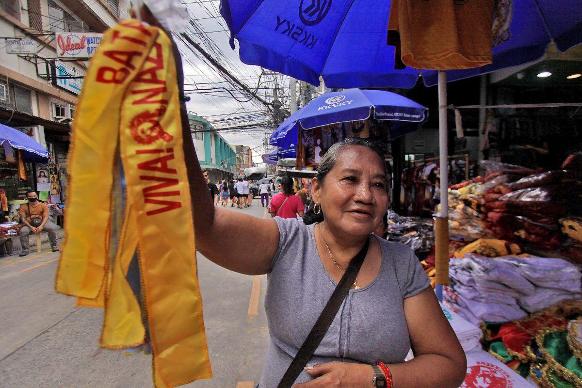 A vendor shows headbands that Nazareno devotees could wear