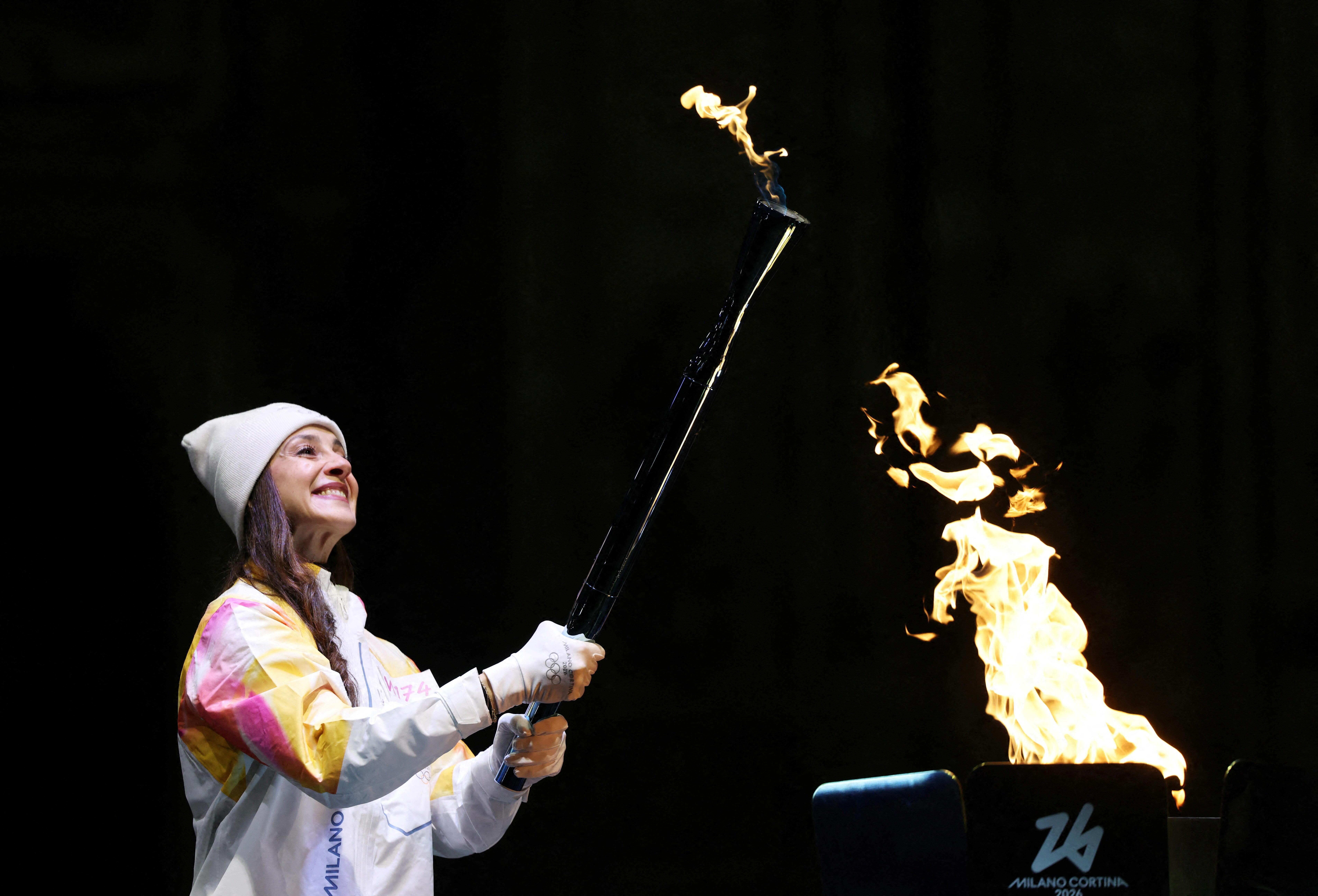 Olympic torch arrives in Milan to cheers and protests