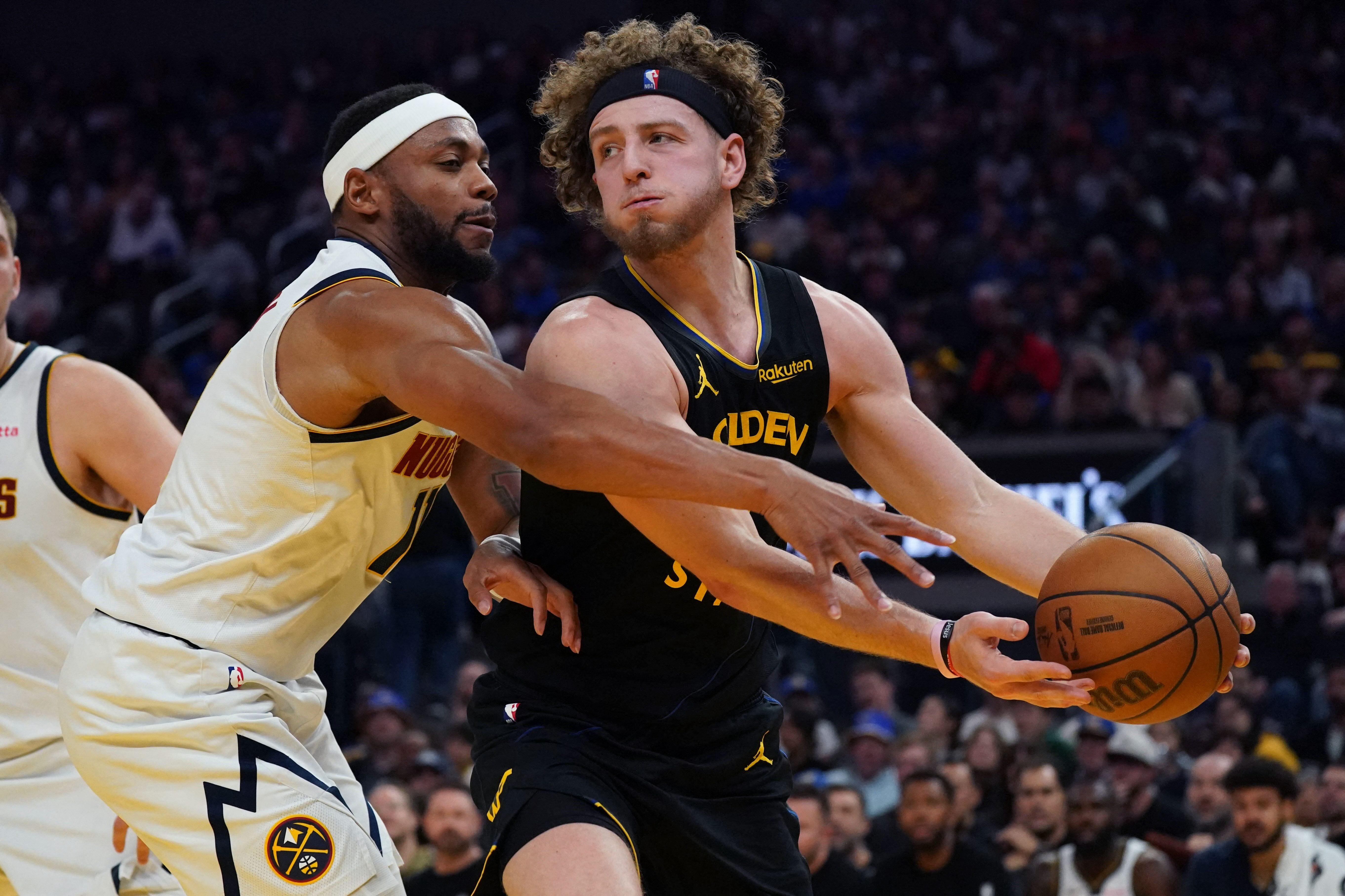 NBA: Short-handed Warriors use late surge to upend Nuggets