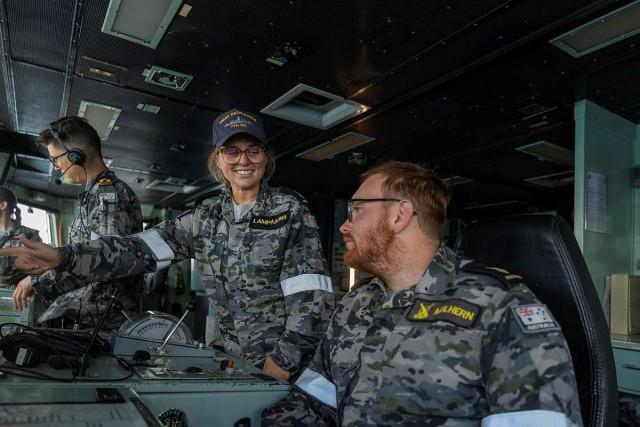 Able Seaman Boatswains Mate Chloe Lampasona (left) provides helm training to Able Seaman Boatswains Mate Blake Mulhern (right) on the bridge of HMAS Toowoomba while in the South China Sea. Courtesy: LSIS Zac Dingle/ Royal Australian Navy