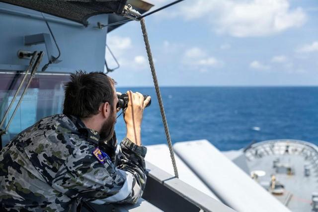 Leading Seaman Boatswains Mate Jack Dimmack looks out at the horizon as bridge watch on HMAS Toowoomba while in the South China Sea. Courtesy: LSIS Zac Dingle/ Royal Australian Navy 