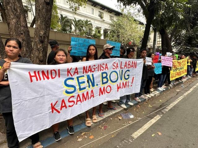 Supporters of former senator Bong Revilla Jr. stage a protest in front of the Department of Justice (DOJ) in Manila City on Thursday, February 12, 2026. Revilla was brought to the DOJ for the preliminary investigation on his plunder complaint in relation to the flood control controversy. SANDRA AGUINALDO/ GMA Integrated News