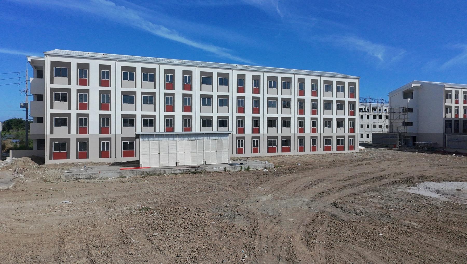 DOTr turns over first housing units for NSCR-affected families