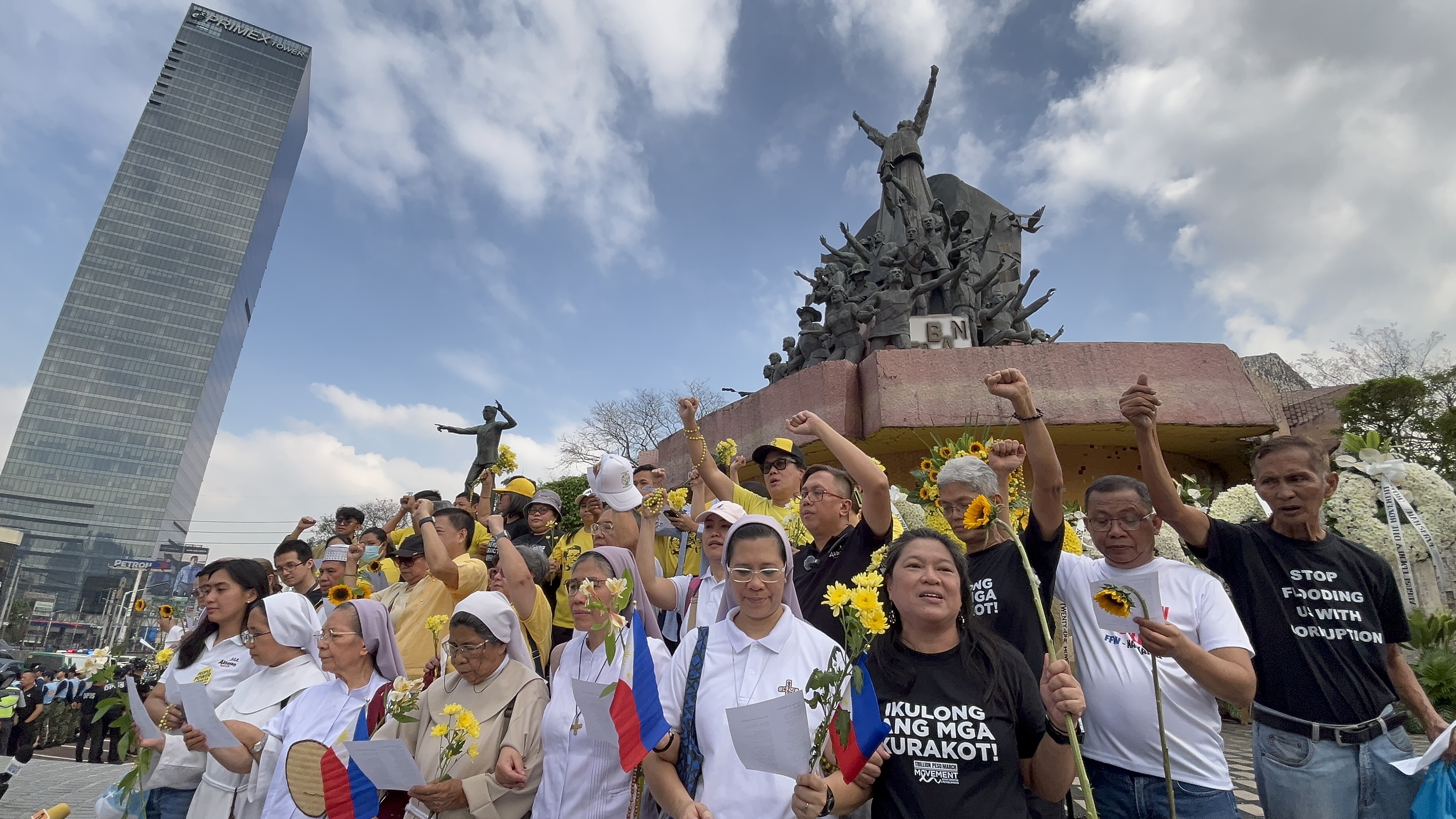Protesters march from EDSA Shrine to People Power Monument 