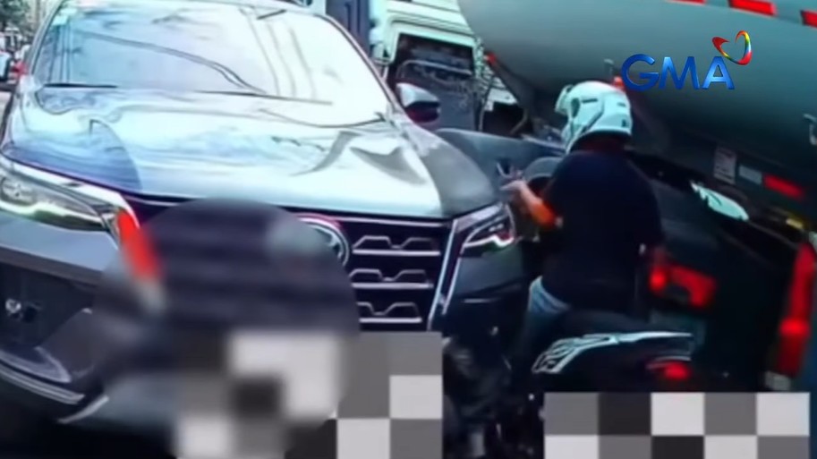 Counterflowing rider almost pinned between SUV, truck in viral video