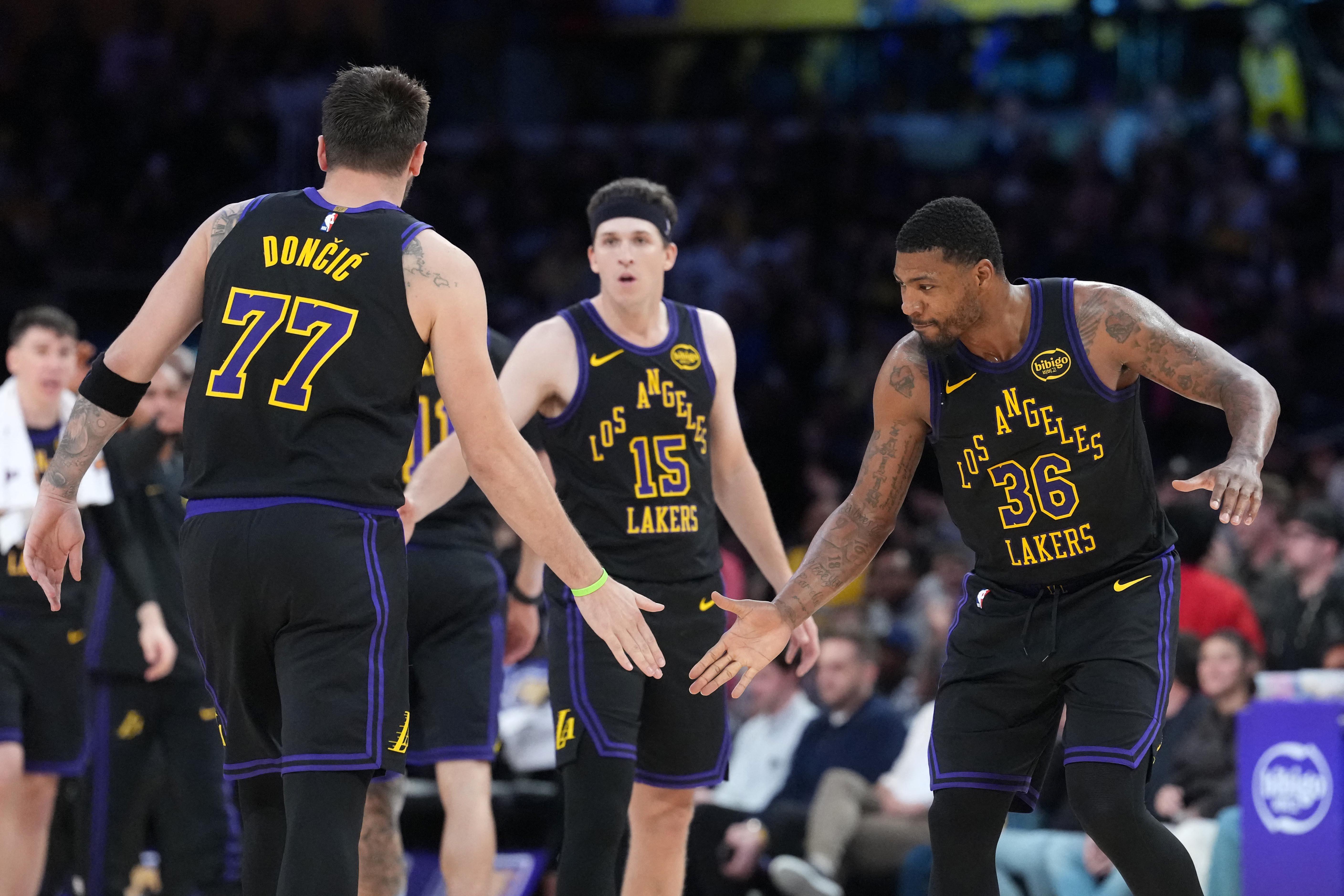 NBA: Luka Doncic Marcus Smart and Austin Reaves of the Lakers