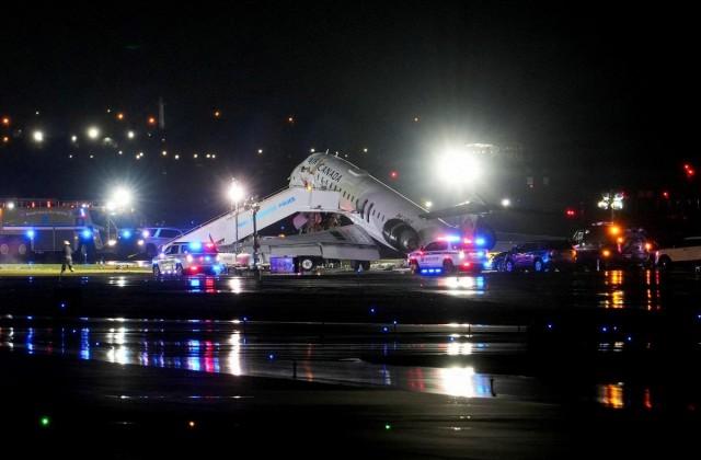 Emergency crews work around an Air Canada Express jet that had collided with a ground vehicle at LaGuardia Airport in Queens, New York, March 23, 2026. REUTERS/ Adam Gray
