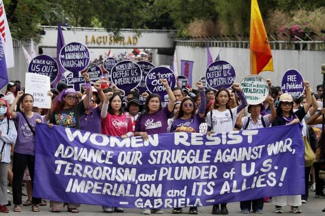 Thousands of members of the Gabriela women's group and allied organizations march towards the US Embassy in Manila on March 8, 2026, International Working Women's Day, to protest US troops' presence and military action. DANNY PATA