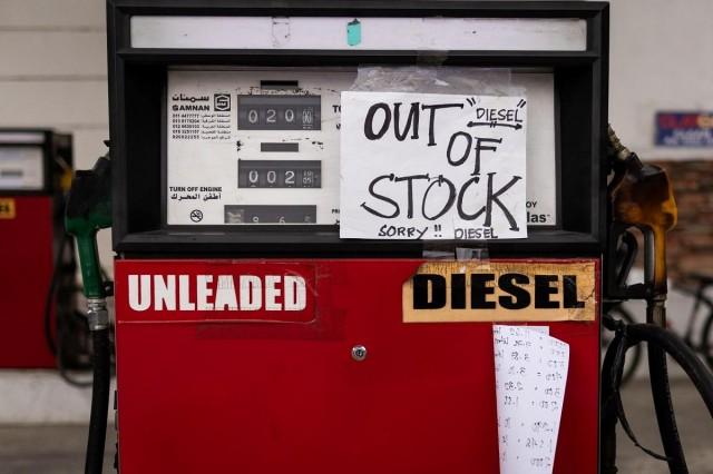 An out of stock notice is taped on the diesel dispenser at a gasoline station in Tuba, Benguet, March 31, 2026. REUTERS/ Eloisa Lopez