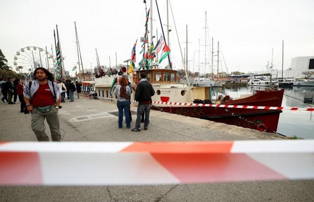 People gather as the humanitarian Global Sumud Flotilla prepares to depart for Gaza carrying medical aid and supplies, from Barcelona, Spain, April 12, 2026. REUTERS/ Albert Gea