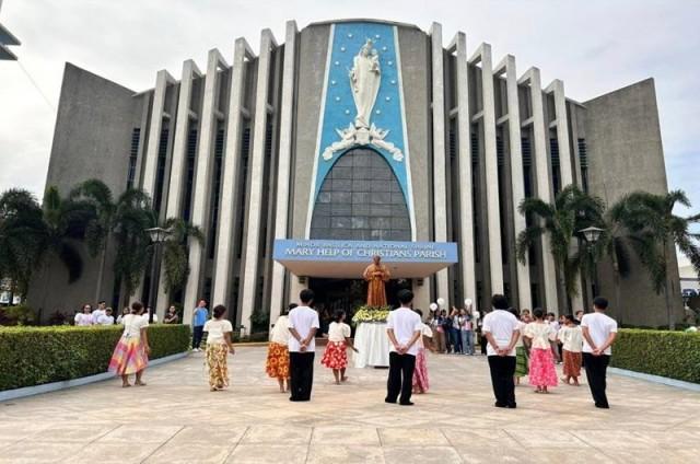 The youth performs a dance in front of the church during the feast of St. John Bosco. Photo from Minor Basilica and National Shrine of Mary Help of Christians