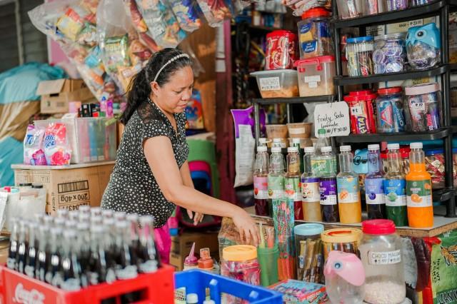 Sari-sari store owner Juvy Camante regularly tracks her inventory.