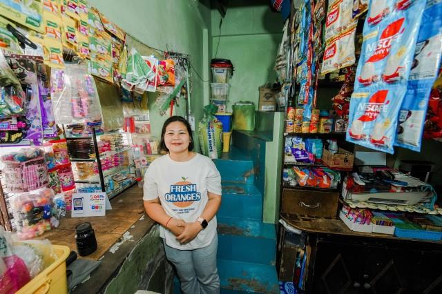 Sari-sari store owner Angelyn Avila finds it convenient to repay her loans via the app.