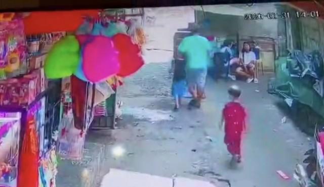 CCTV footage showing the 5-year-old victim with the suspect. (Photo from Navotas City Police)