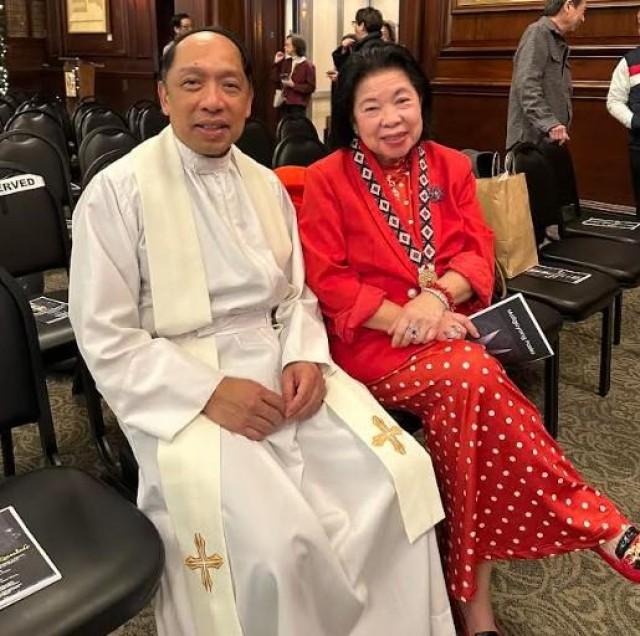 FILCA's Fr. Rhey Garcia with community leader Dely Go who will be Reyna Emperatriz. Courtesy: The FilAm