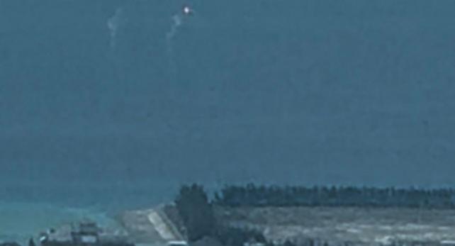 China launches flares as a PCG plane flies 3 nautical miles from Mischief Reef. (Photo by Jun Veneracion)