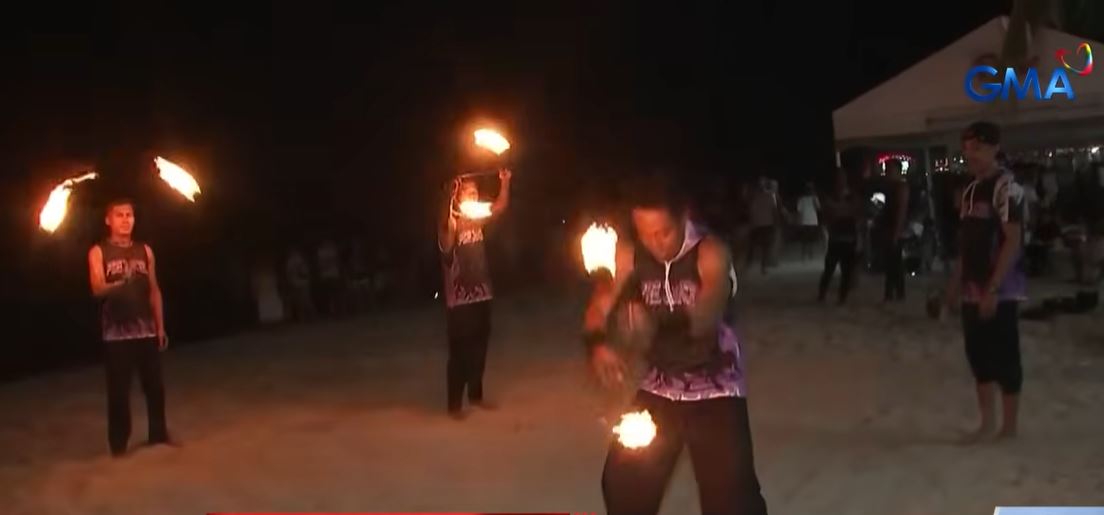 Fire dancers in Puerto Galera feel the heat of oil price hikes