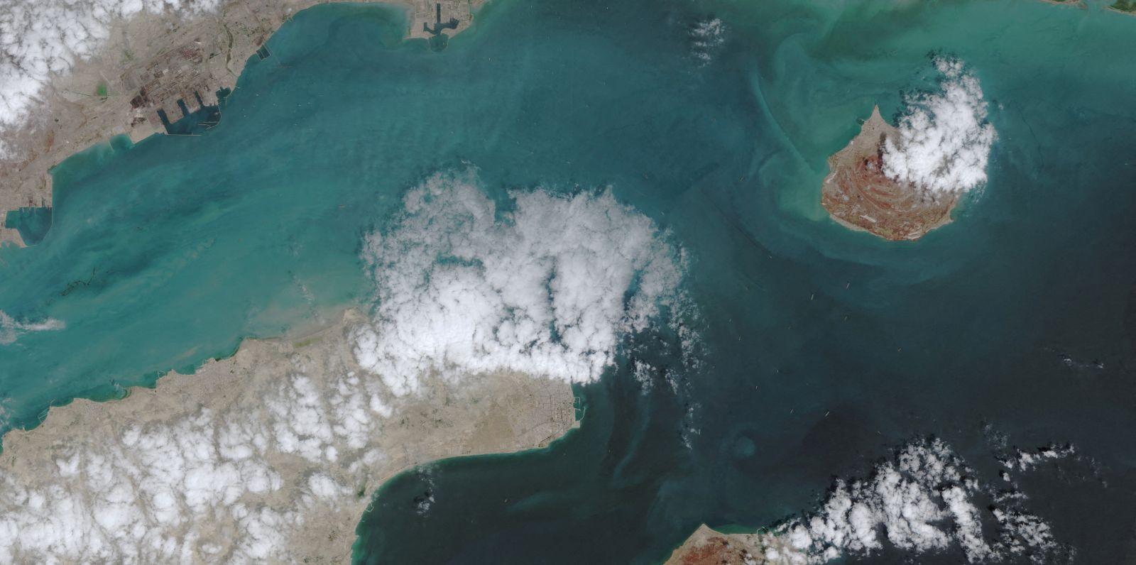 A satellite image shows the ship movement at the Strait of Hormuz