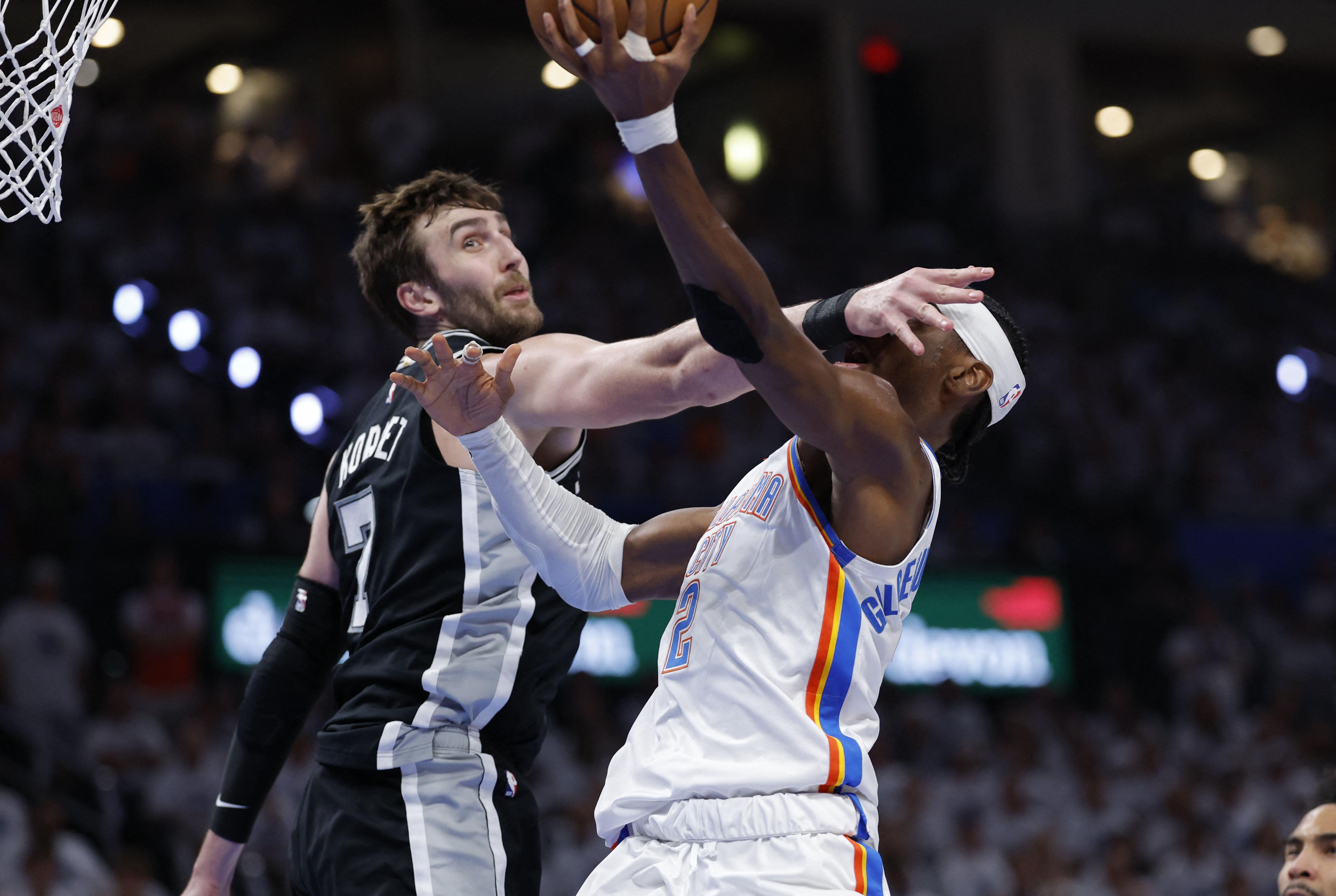 NBA: Spurs’ Luke Kornet fouls Thunder’s Shai Gilgeous-Alexander