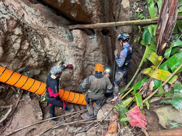 A Thai volunteer group joined the rescue operation on Sunday. The team included a diver who took part in the 2018 rescue of 12 boys and their soccer coach from a flooded cave in northern Thailand. Metta Tham Kalasin Rescue/ Handout via REUTERS