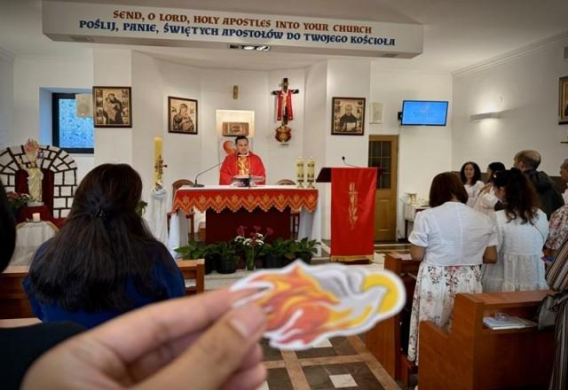 At Pentecost Sunday Mass, Fr. Tirso Alcover (in the background) hoped that churchgoers would live by the values mentioned in the
