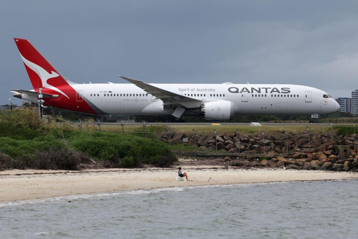 A Qantas Dreamliner taxis along a runway at Sydney Airport in February 2026
