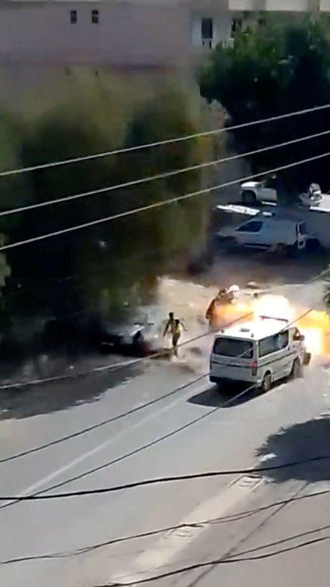 An ambulance is hit by an Israeli strike, in Deir Qanoun En-Nahr, Lebanon