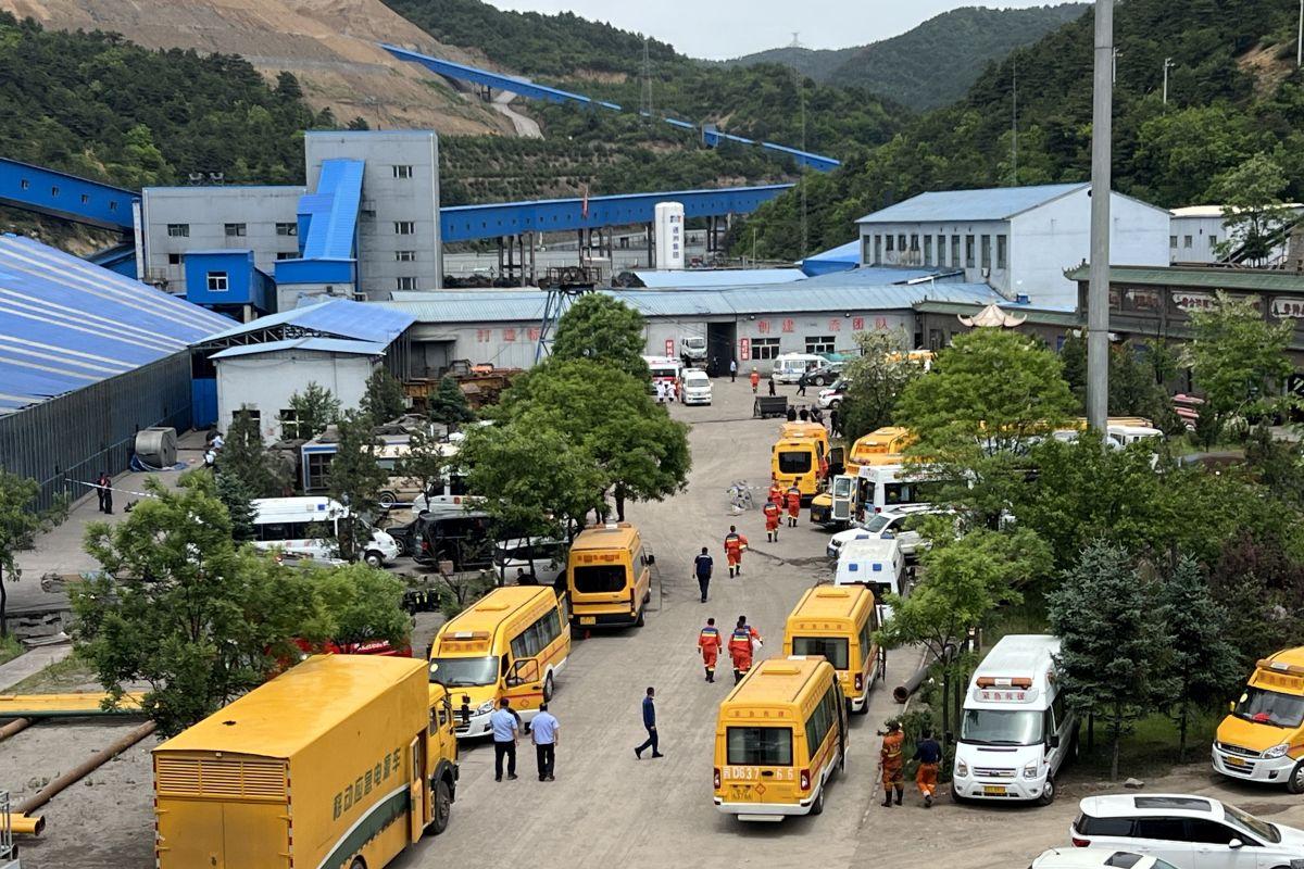 Rescuers work at the site of gas explosion at China coal mine