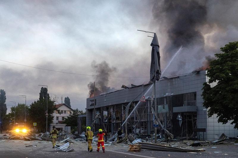 fire in a car dealership in Kyiv that was struck during overnight Russian missile and drone attacks