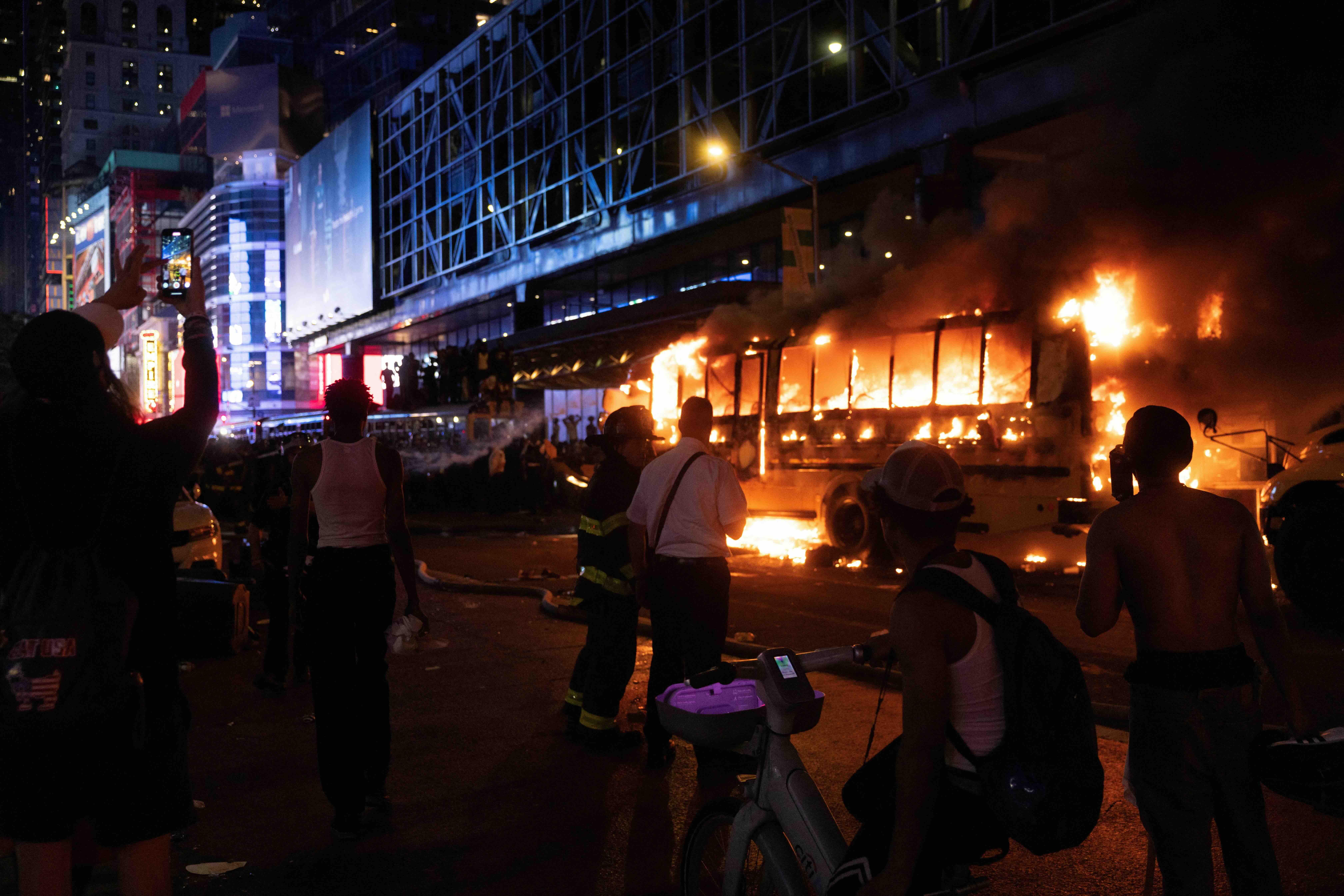 World Cup bus set alight as chaotic celebrations erupt in Manhattan after Knicks win