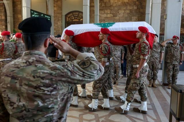 Members of the Lebanese military carry a coffin during the funeral of Brigadier General Wissam Sabra, who was killed in an Israeli strike targeting their military vehicle on the Khardali-Nabatieh road in south Lebanon on Saturday, in Beirut, Lebanon June 7, 2026. REUTERS/ Mohamed Azakir