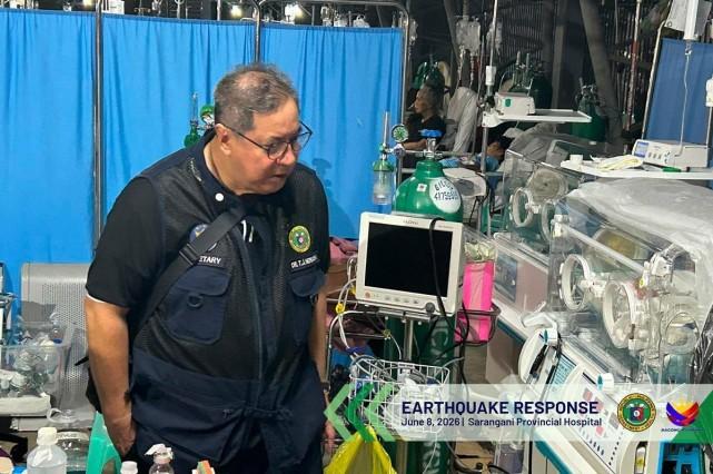 Health Secretary Ted Herbosa inspects babies in incubators placed outdoors at the Sarangani Provincial Hospital after the 7.8 magnitude earthquake that hit the region on June 8, 2026. Photo: Department of Health