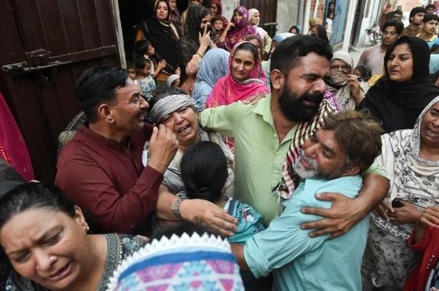 Relatives of the children reportedly died after a tuition center roof collapsed, mourn in Lahore, Pakistan, June 30, 2026. REUTERS/ Murtaza Ali