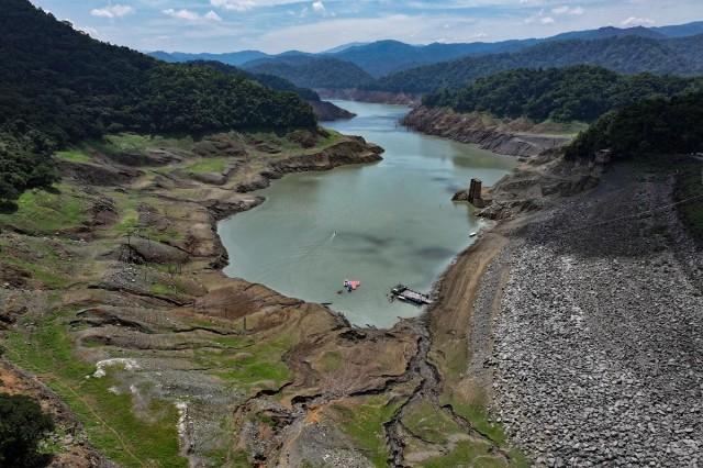 A drone view shows the receding shoreline of the Angat Dam during a dry spell pushing the Philippines' key reservoir below critical level in Norzagaray, Bulacan July 15, 2026. REUTERS/ Adrian Portugal