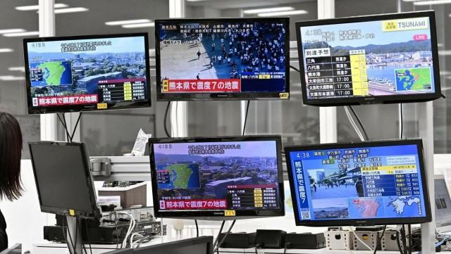 Television screens in Osaka, western Japan, show news of the earthquake. Kyodo/ via REUTERS