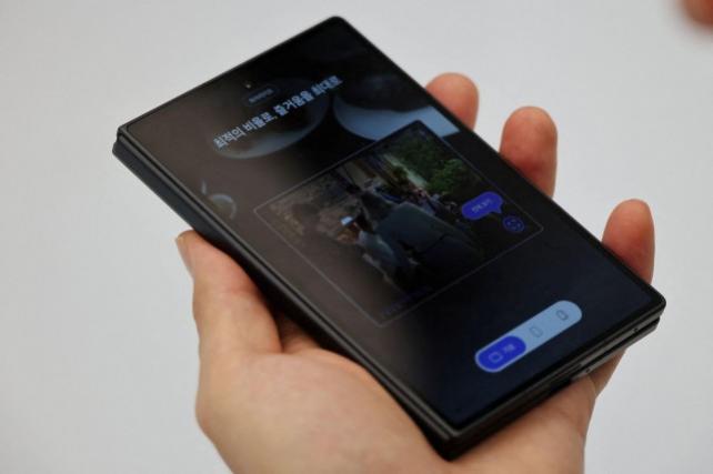 A man takes a look at a Samsung Electronics' Galaxy Z Fold 8 Wide phone at its store in Seoul, South Korea, July 23, 2026. REUTERS/Kim Hong-Ji