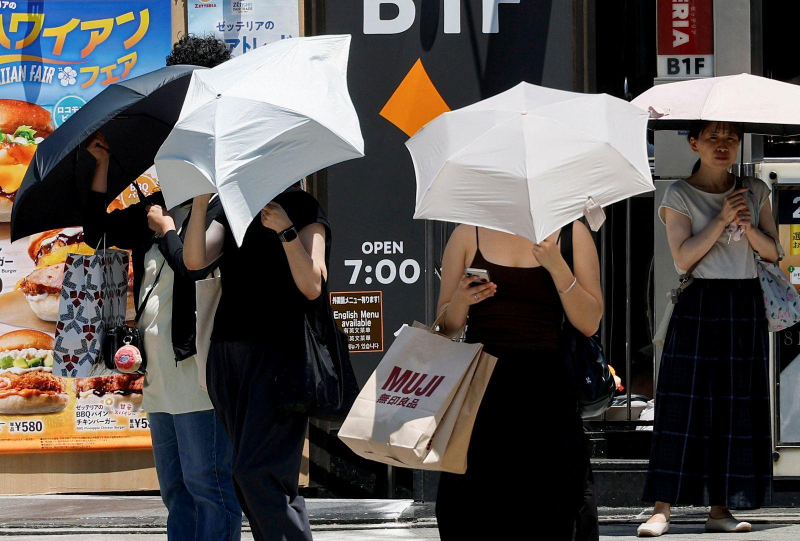 Keeping cool, Tokyo style: Shorts, sneakers and no ties