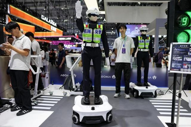Traffic police humanoid robots by AiMOGA Robotics demonstrate a gesture during the 2026 World Robot Conference, in Beijing, China August 19, 2026. REUTERS/ Tingshu Wang