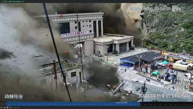 CCTV footage shows people running away as wall of mud and water destroys buildings in a valley at Nepal-China border, in Gyirong, Tibet region, August 26, 2026, in this screengrab obtained from a social media video. SOCIAL MEDIA/via REUTERS