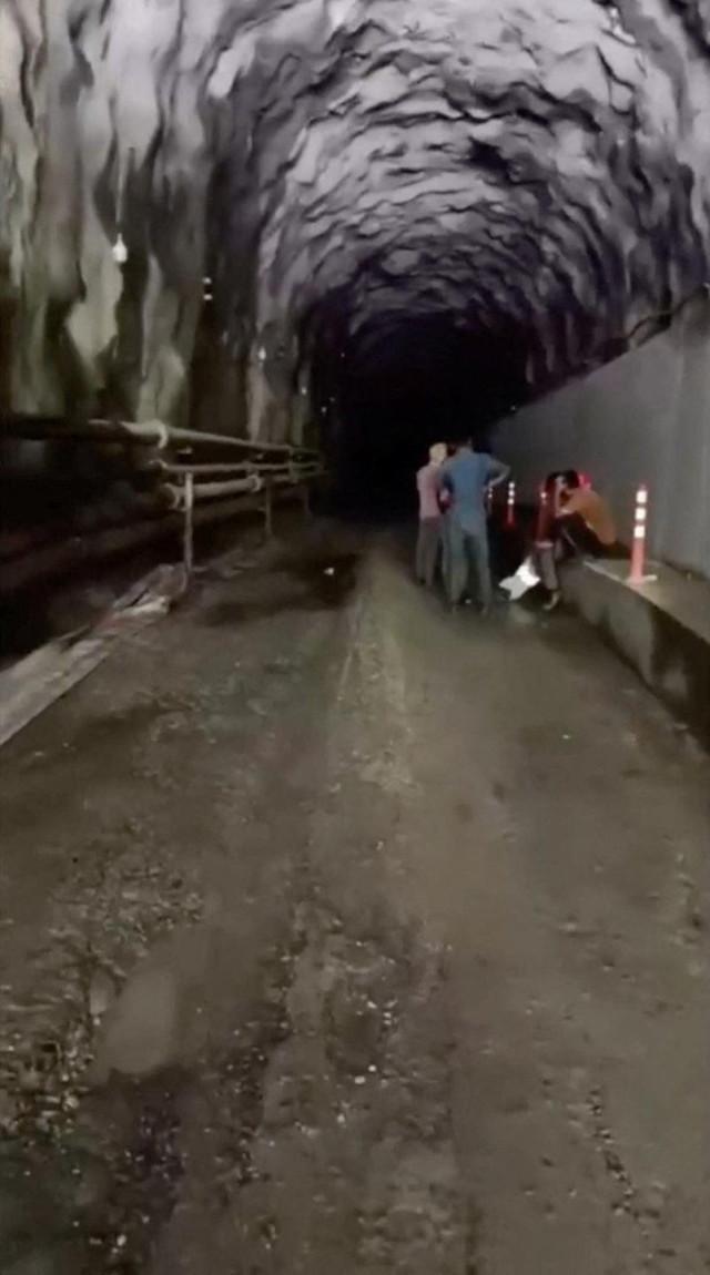 People who were stuck in the tunnel of a hydropower project, in the aftermath of flash floods and a mudslide, as they are rescued, in Rasuwa, Nepal, in this still image from handout video released August 28, 2026. PMO Nepal/ Handout via REUTERS