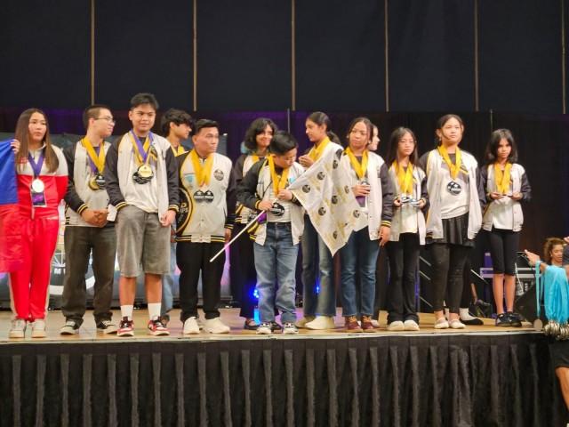 Team UAE performers pose on stage with their medals at the 2026 World Championships of the Performing Arts (WCOPA) in Las Vegas, Nevada last July. Courtesy: Elipas C. Sibua