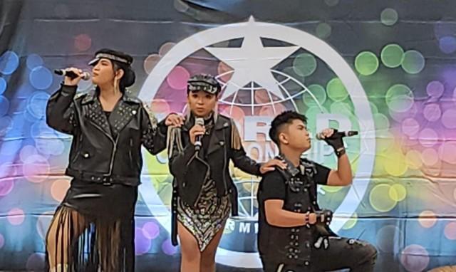 (from left) Kirstin Reyes, Celine Madison Matondo and Heinrich Agsaullo perform their cover of the Queen's Bohemian Rhapsody at the 2026 World Championships of the Performing Arts (WCOPA) in Las Vegas, Nevada last July. Courtesy: Elipas C. Sibua