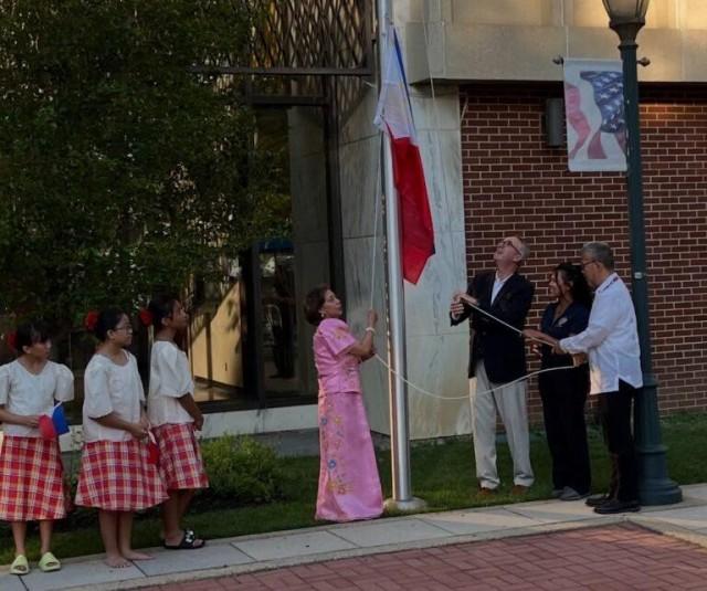 Jiji raises the Philippine flag in a Philippine Independence Day ceremony at the Town Hall of Hempstead in 2024. Courtesy: The FilAm