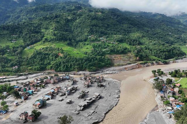 A drone view shows mud covering buildings and property following devastating floods at Trishuli in Nuwakot district, Nepal on August 27, 2026. REUTERS/Navesh Chitrakar