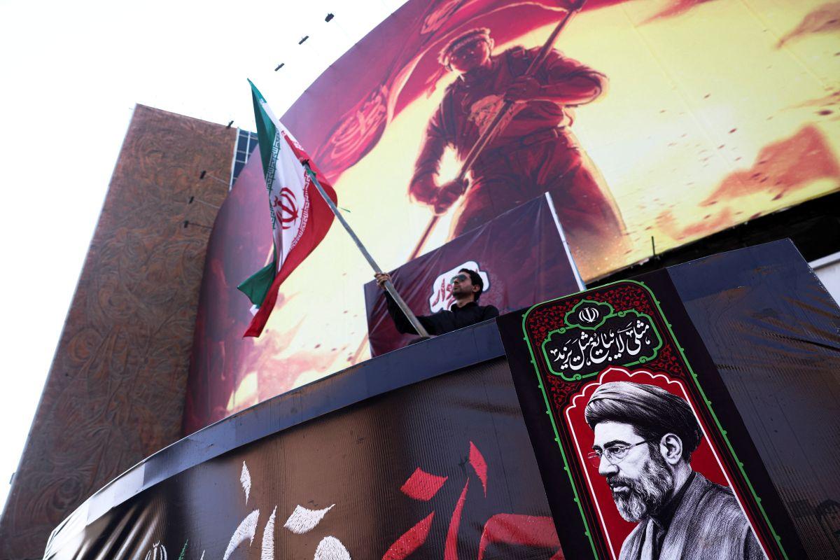Iran flag and photo of Iran Supreme Leader Mojtaba Khamenei