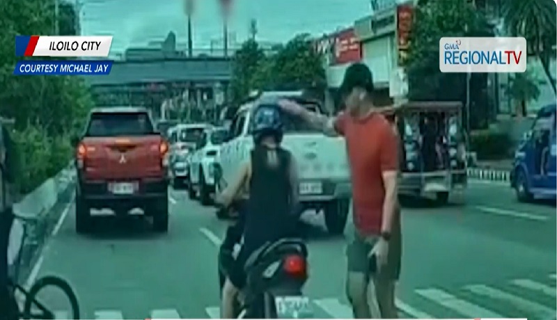 Lalaki, kinaltok sa helmet ang rider na nagtuloy-tuloy sa pagdaan sa pedestrian lane habang may tumatawid