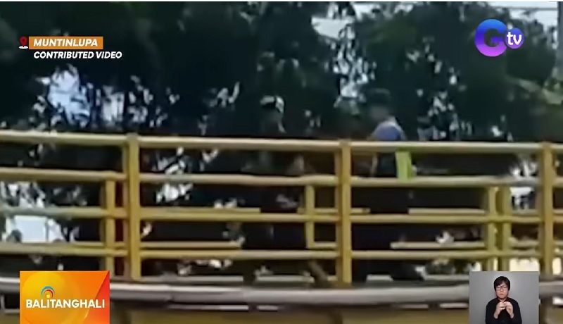 Pulis at holdaper, nagpambuno sa isang footbridge; suspek, sugatan matapos aksidenteng mabaril