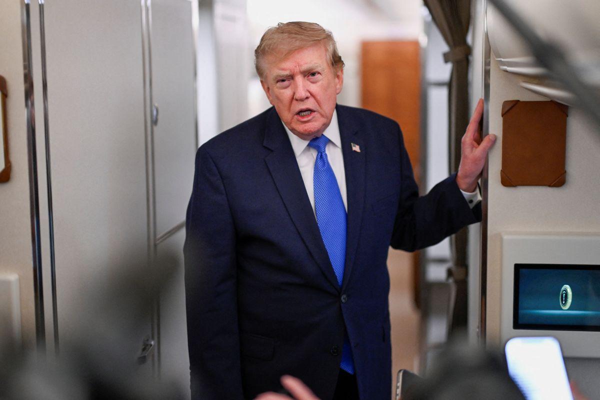 US President Donald Trump speaks to the media aboard Air Force One en route to Joint Base Andrews, in Maryland, US, August 2, 2026