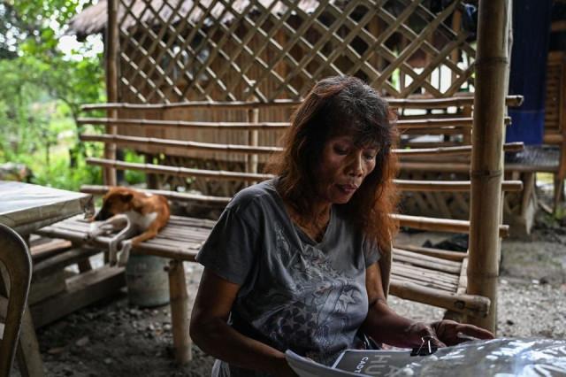 Aeta tribal chieftain Petronila Muñozs holds a draft of the land historical claims in Capas, Tarlac province on September 2, 2026. Jam Sta. Rosa/ AFP